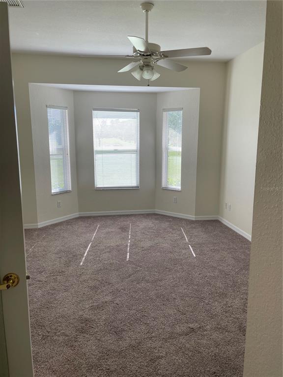 9027 Stone Harbour Loop Bradenton, FL 34212 - Photo 10 of 20 a view of an empty room with a window