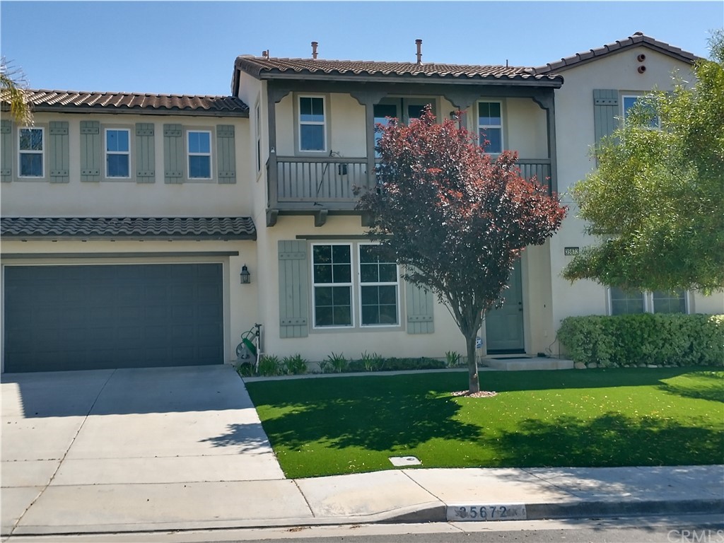 35672 Poplar Crest Road Wildomar, CA 92595 - Photo 1 of 1 a front view of a house with a garden