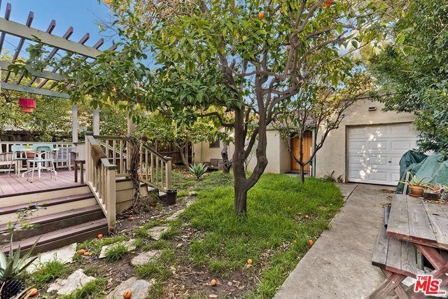 a view of a garden with sitting area