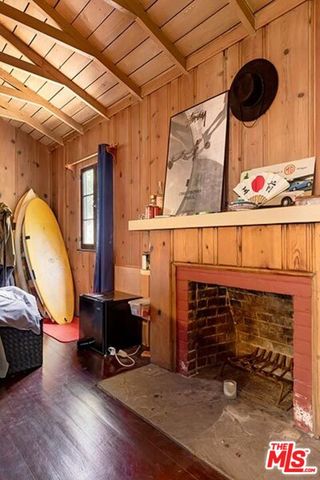 a view of livingroom with furniture and a fireplace