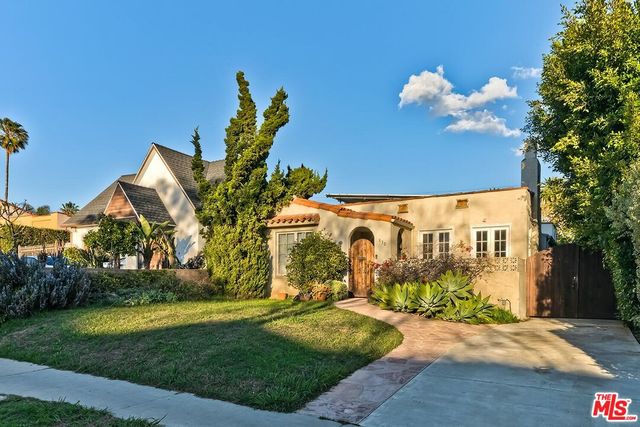 a view of a street with a building in the background