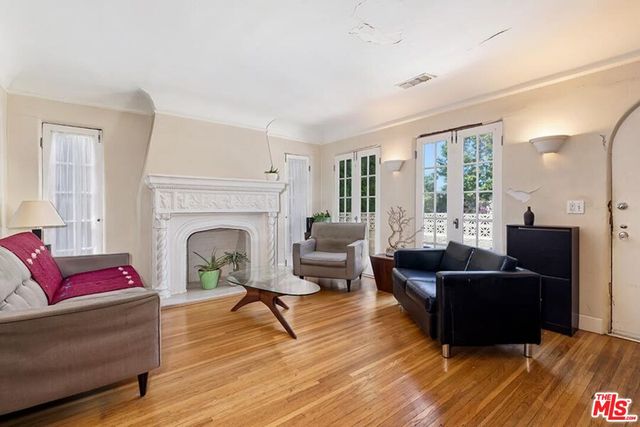 a living room with furniture or couch and a fireplace