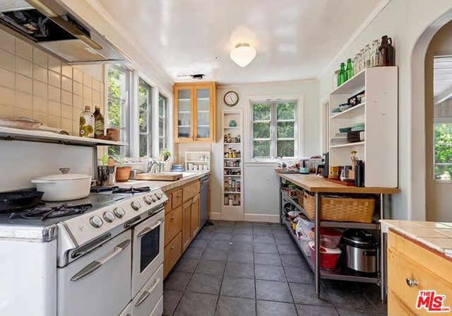 a kitchen with a stove and a sink