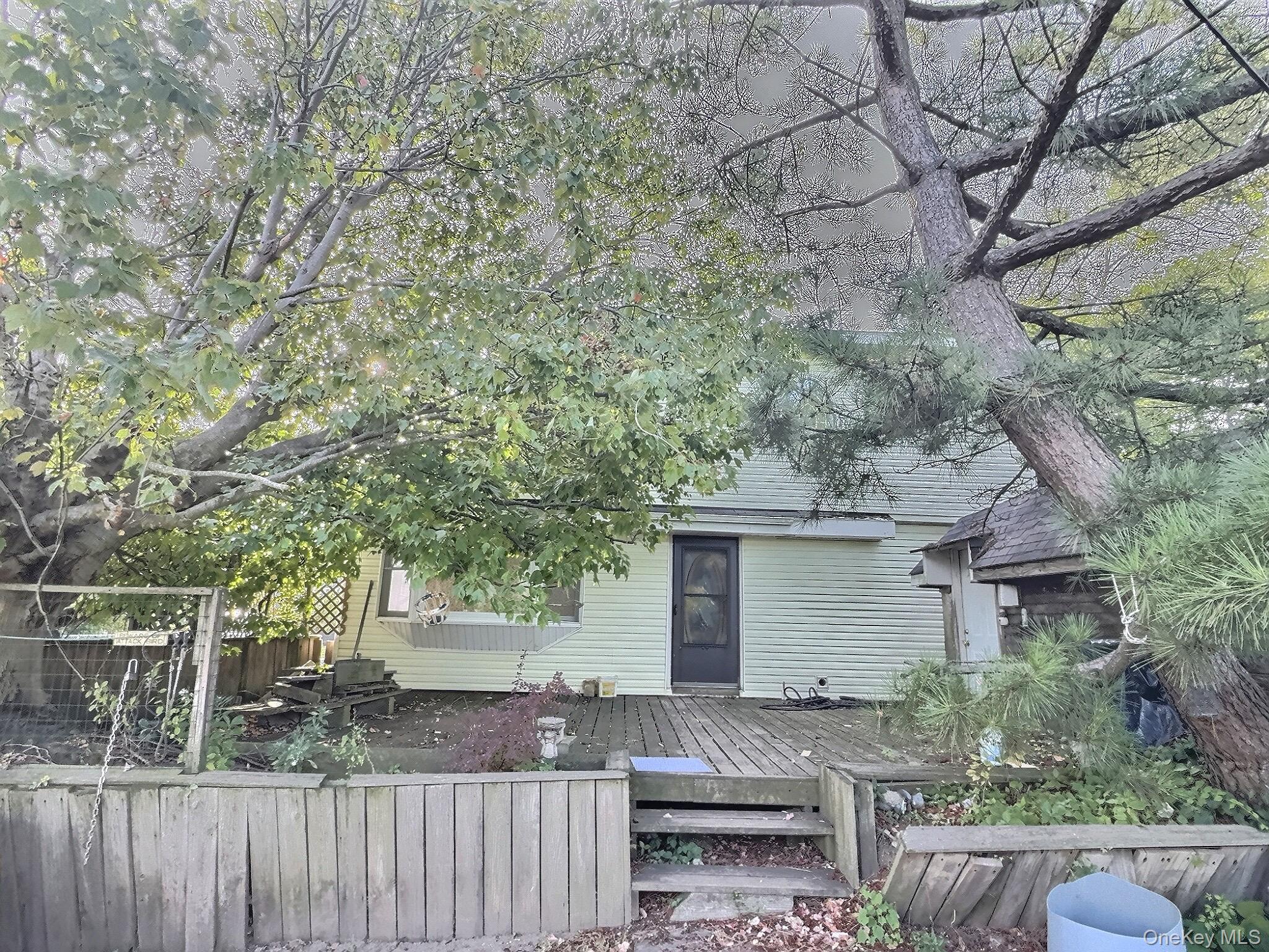 815 Walton Road Queens, NY 11693 - Photo 7 of 7 Back of house with a deck