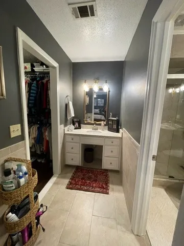 a utility room with sink dryer and washer