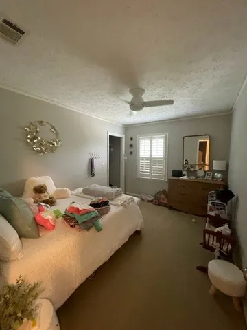 a bedroom with bed and window