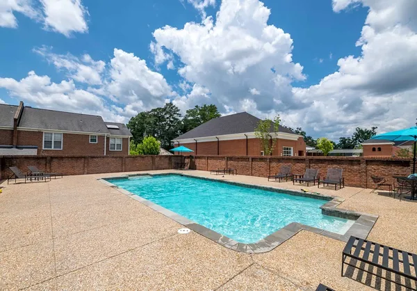 a view of a backyard with sitting area
