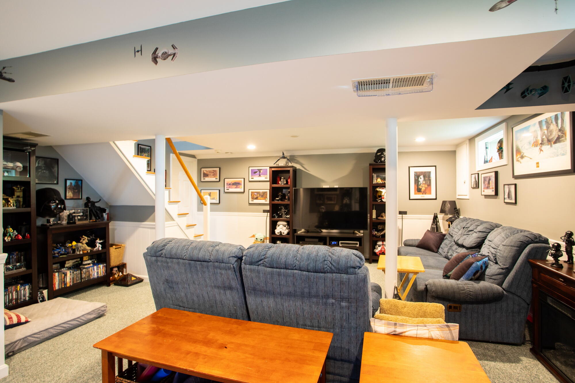 150 Old Mill Road Marstons Mills, MA 02648 - Photo 15 of 29 a living room with furniture a flat screen tv and a fireplace