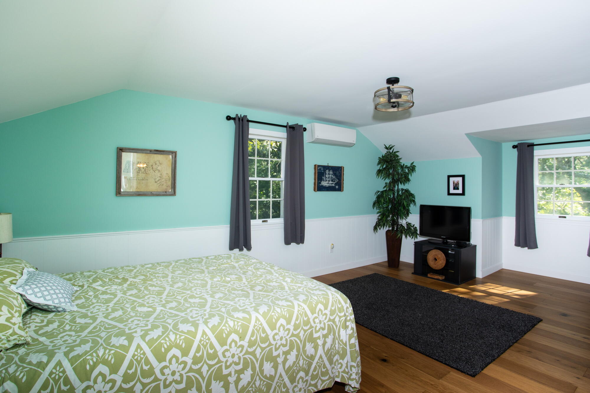 150 Old Mill Road Marstons Mills, MA 02648 - Photo 19 of 29 a bedroom with a bed and a fireplace