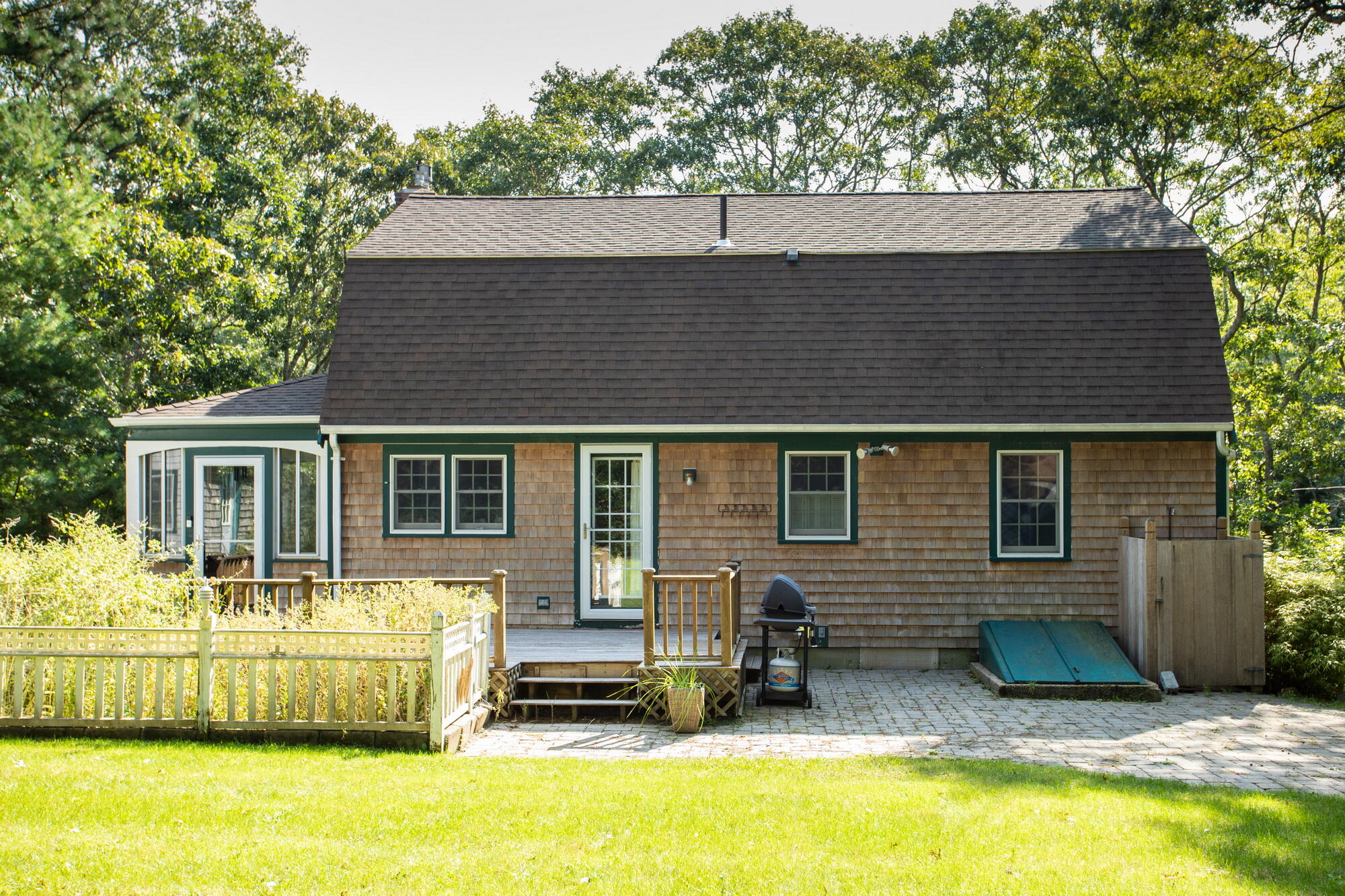 150 Old Mill Road Marstons Mills, MA 02648 - Photo 2 of 29 a backyard of a house with seating space