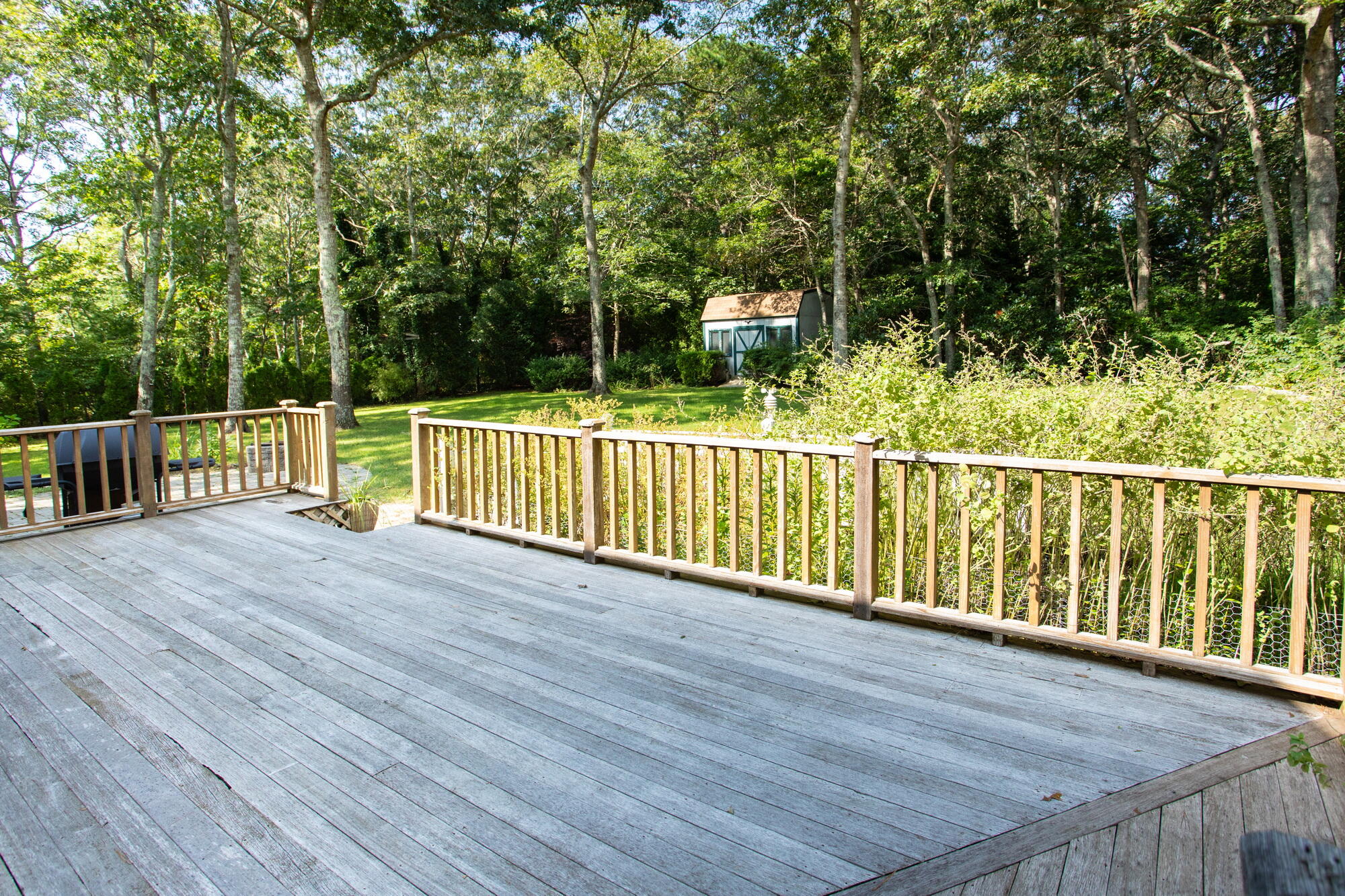 150 Old Mill Road Marstons Mills, MA 02648 - Photo 23 of 29 a view of a balcony with trees