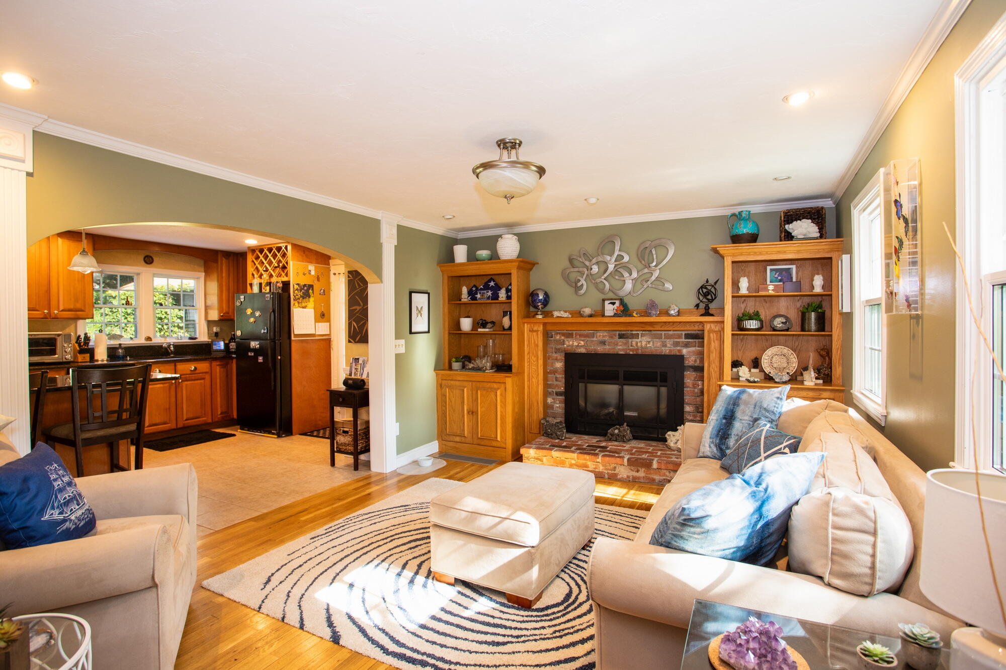150 Old Mill Road Marstons Mills, MA 02648 - Photo 9 of 29 a living room with furniture a fireplace and a flat screen tv