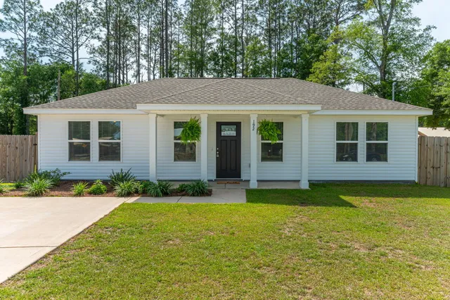a view of a house with a yard