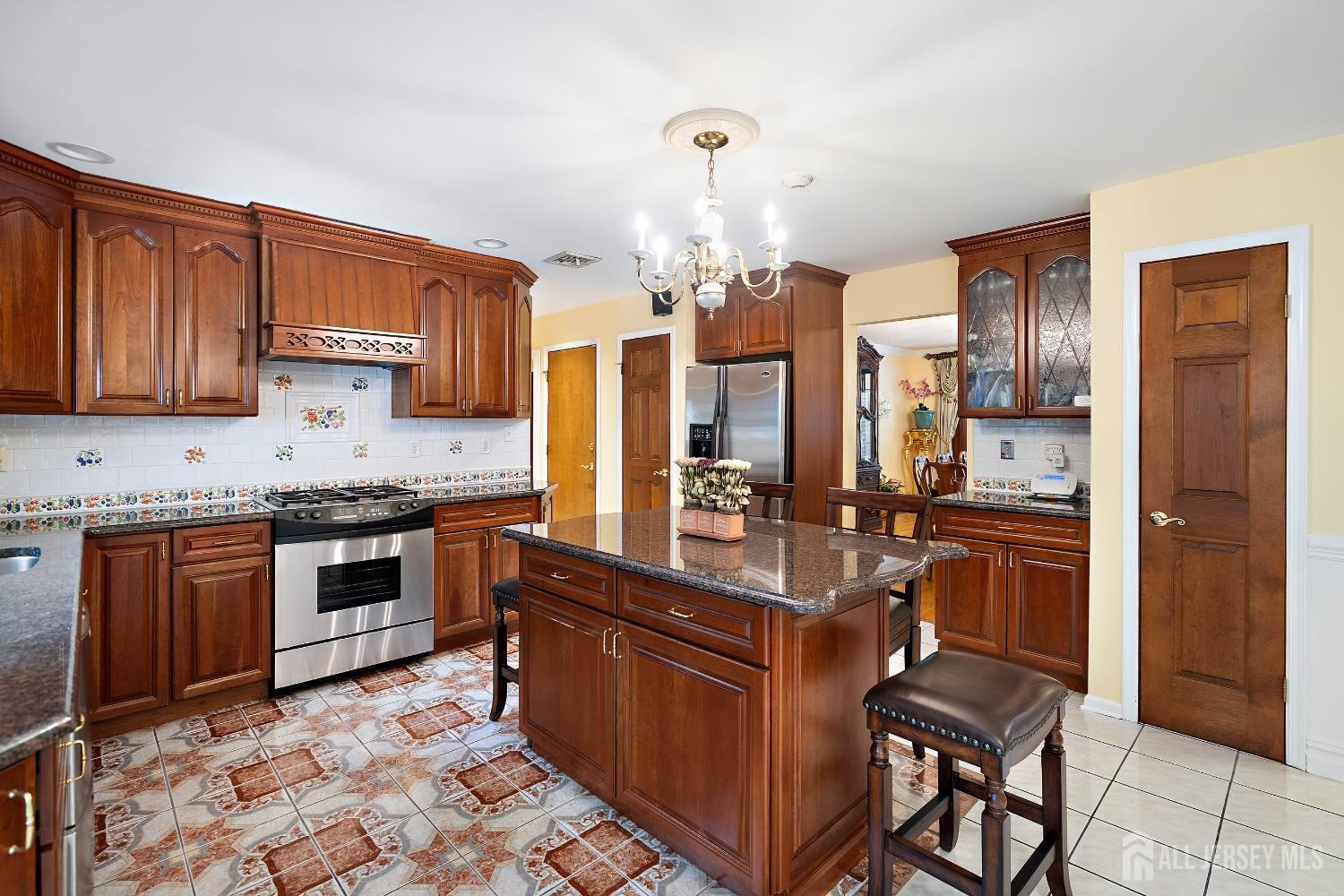 3 Anthony Avenue Edison, NJ 08820 - Photo 15 of 41 a kitchen with stainless steel appliances granite countertop a refrigerator a stove a sink and dishwasher