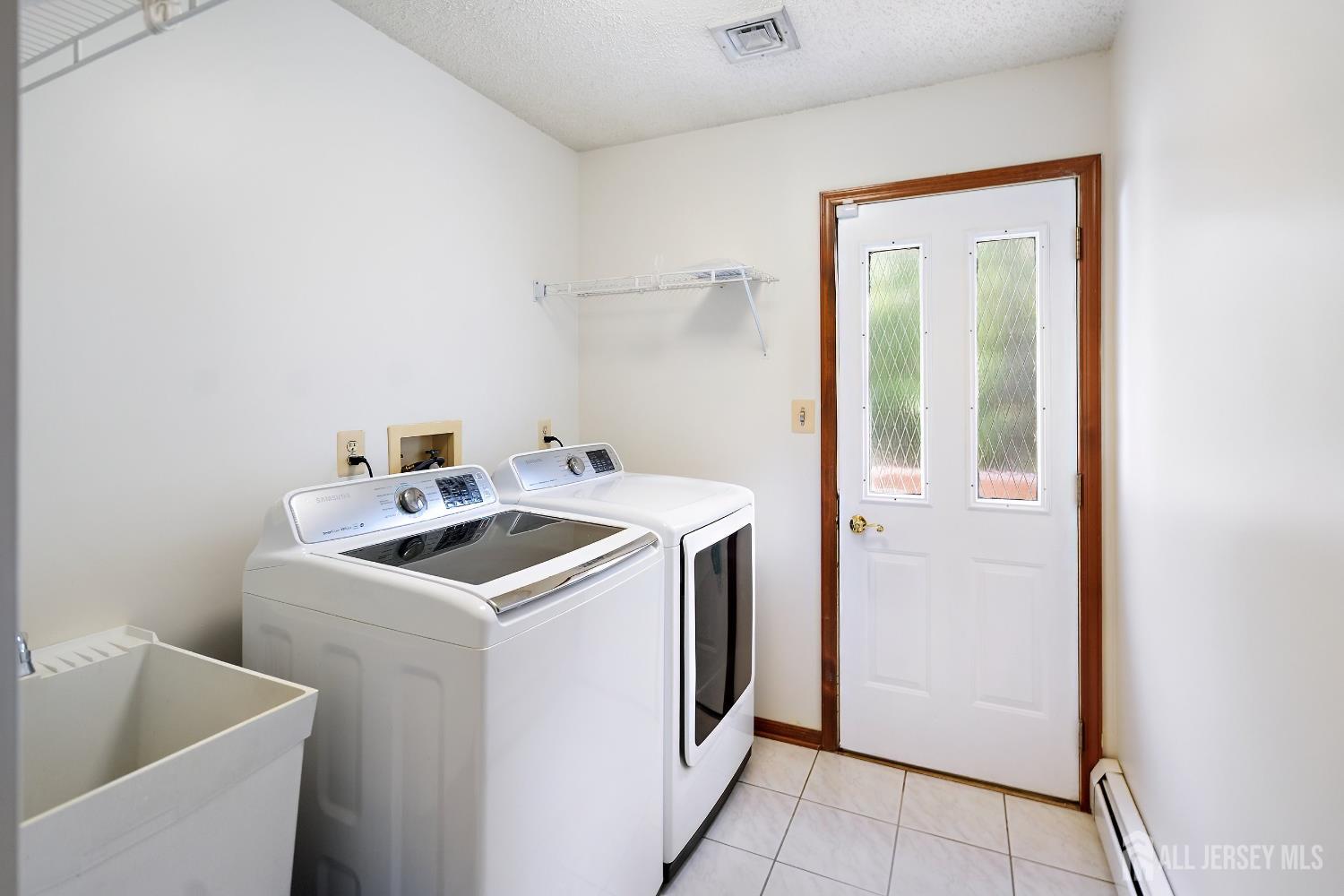 3 Anthony Avenue Edison, NJ 08820 - Photo 18 of 41 a utility room with dryer and washer