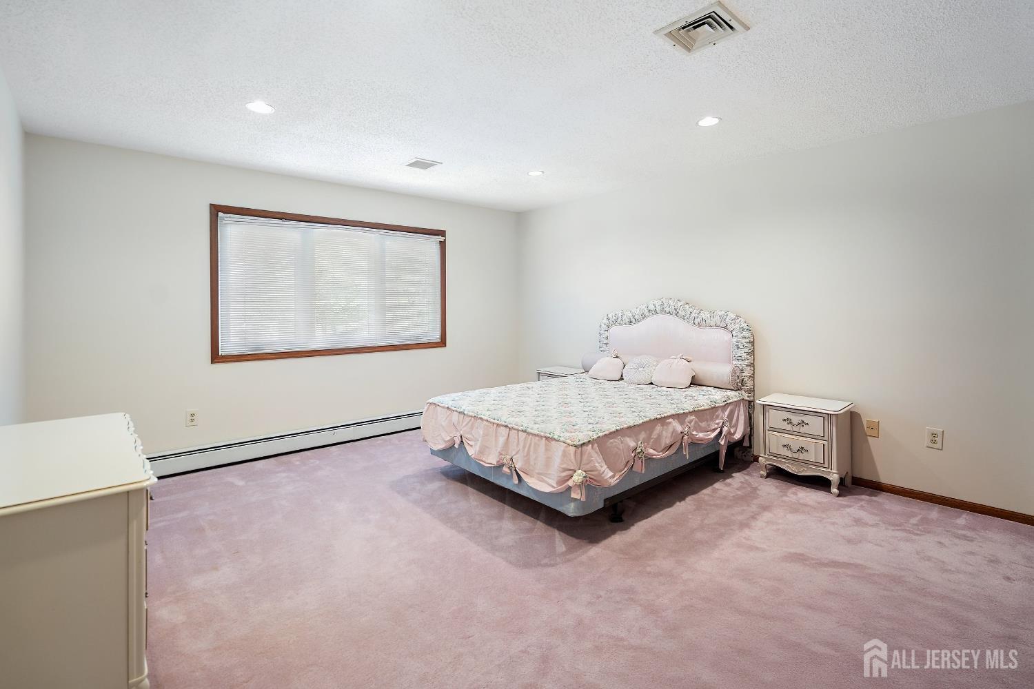 3 Anthony Avenue Edison, NJ 08820 - Photo 20 of 41 a bedroom with a bed and a window