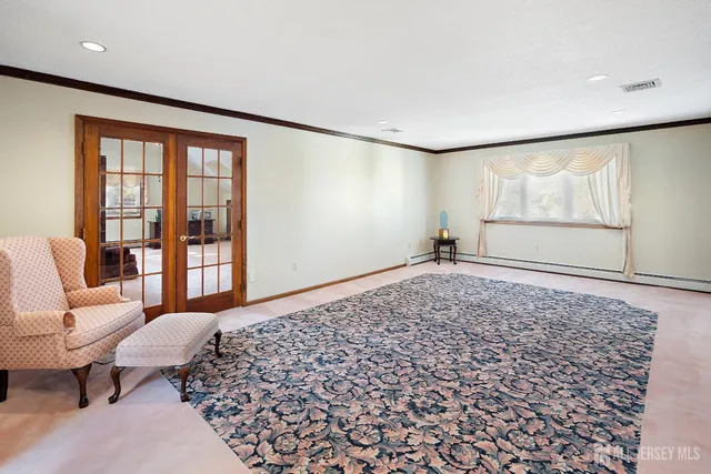 a living room with a couch and a large window