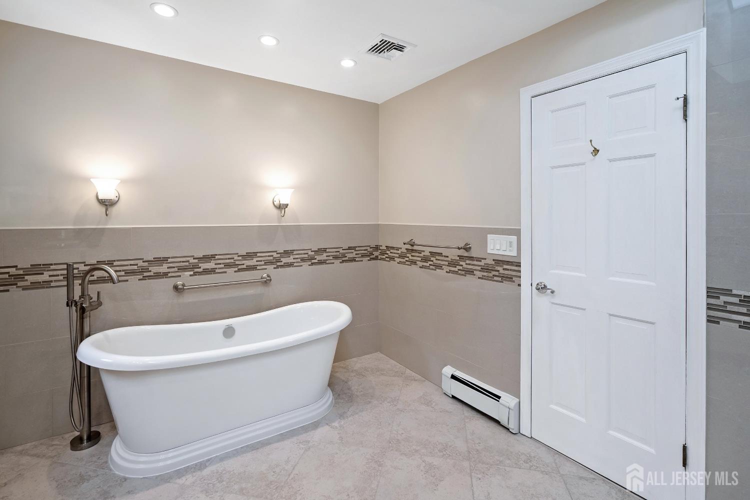 3 Anthony Avenue Edison, NJ 08820 - Photo 29 of 41 a bathroom with a sink a window and a shower