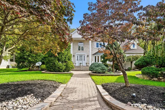 a house with garden in front of it
