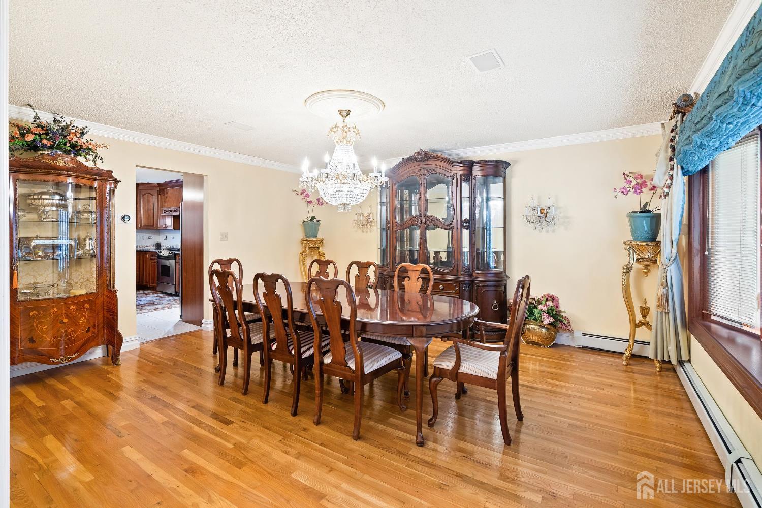 3 Anthony Avenue Edison, NJ 08820 - Photo 8 of 41 a view of a dining room with furniture and wooden floor