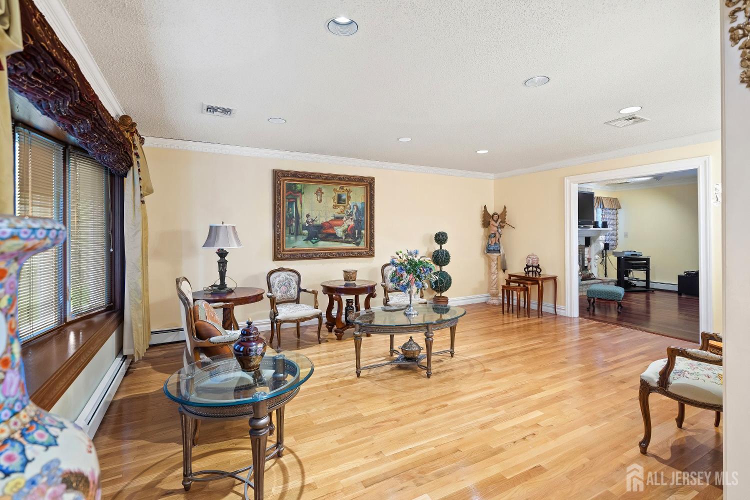 3 Anthony Avenue Edison, NJ 08820 - Photo 10 of 41 a living room with furniture a wooden floor and next to a window