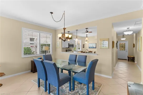 a dining room with furniture and window