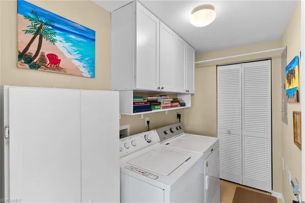 a utility room with dryer and washer