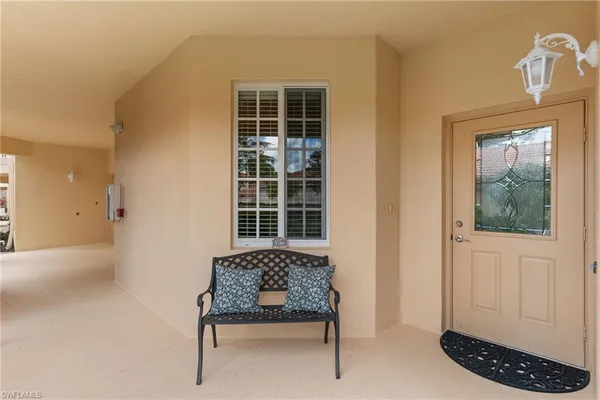 a view of a room that has a bed and a window