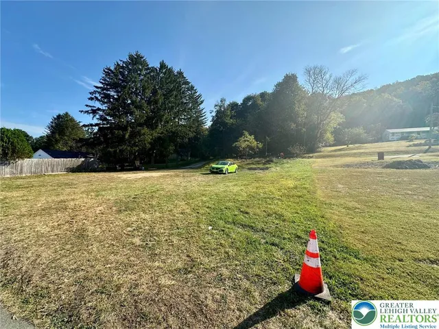 a view of a room with floor to ceiling window and mountain view