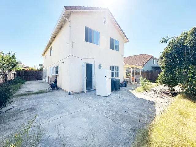 a view of a house with a patio