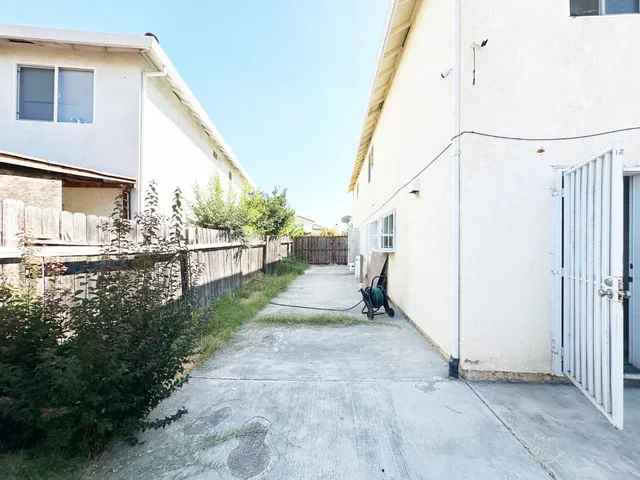 a view of a balcony with trees