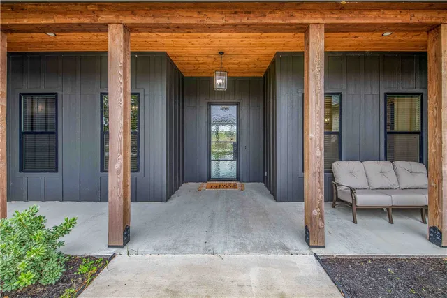 a view of a hallway with seating space