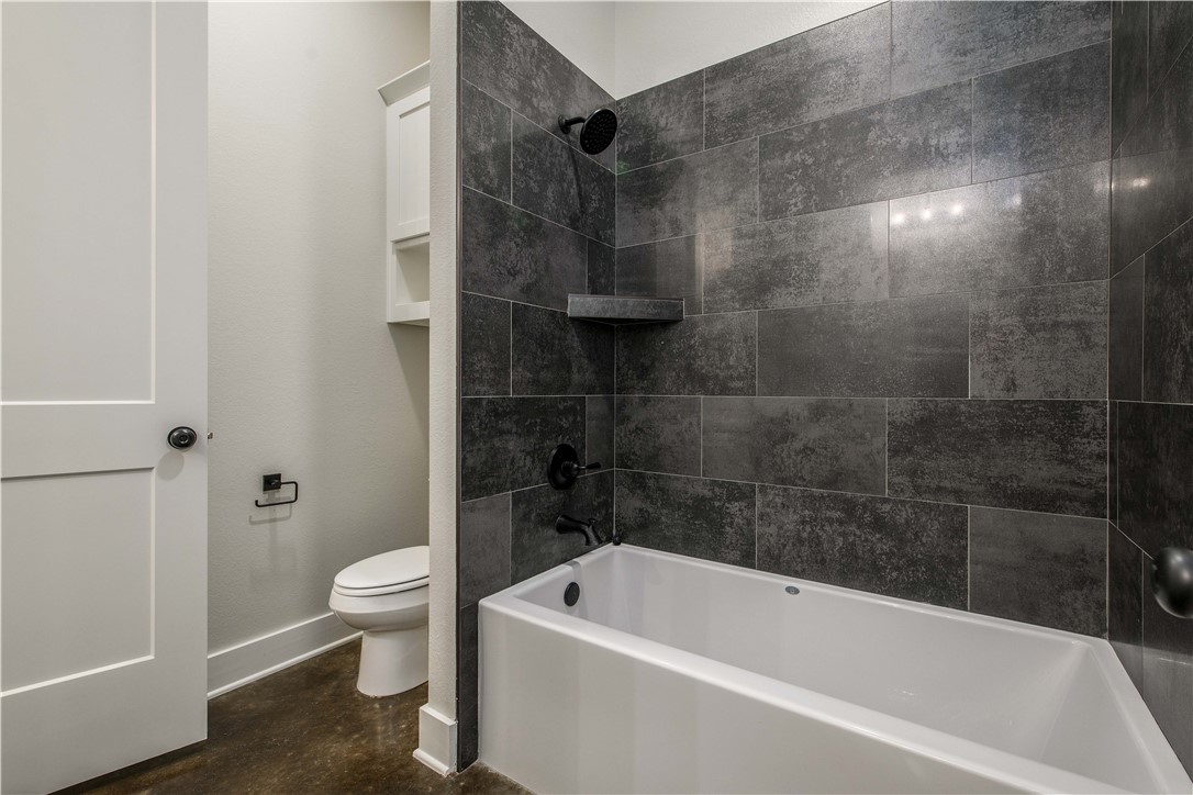 7532 Mary's Way Bryan, TX 77808 - Photo 23 of 38 a bathroom with a bathtub and toilet