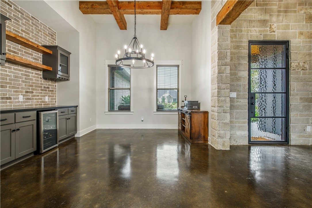7532 Mary's Way Bryan, TX 77808 - Photo 7 of 38 a view of a livingroom with furniture wooden floor and chandelier