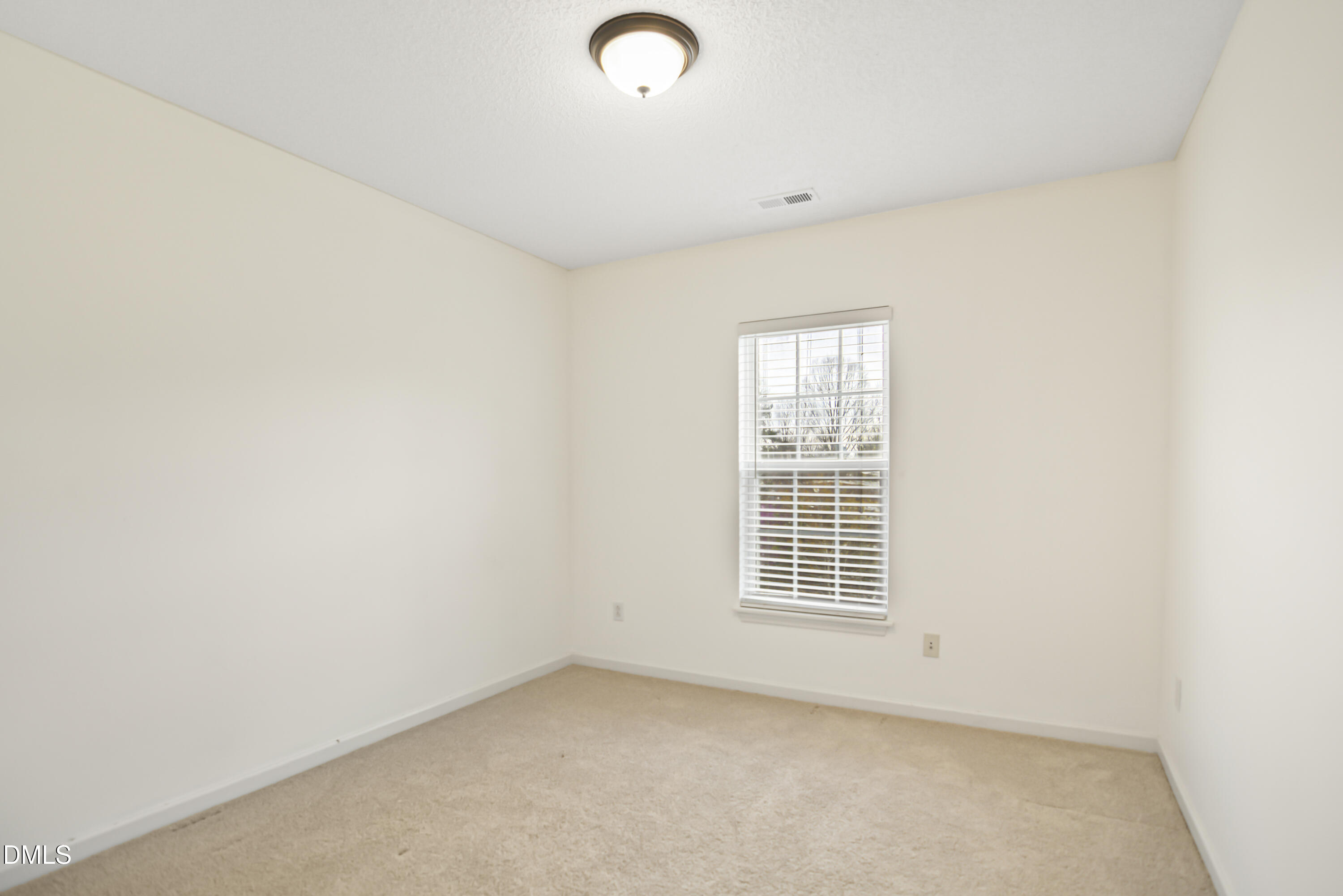 2241 Spruce Shadows Lane Raleigh, NC 27614 - Photo 22 of 29 an empty room with windows
