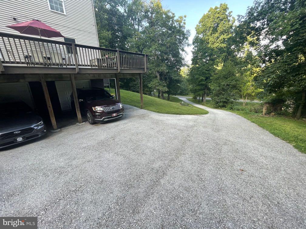 604 Rocky Ridge Road Spring Grove, PA 17362 - Photo 7 of 47 Serene driveway amidst lush greenery.