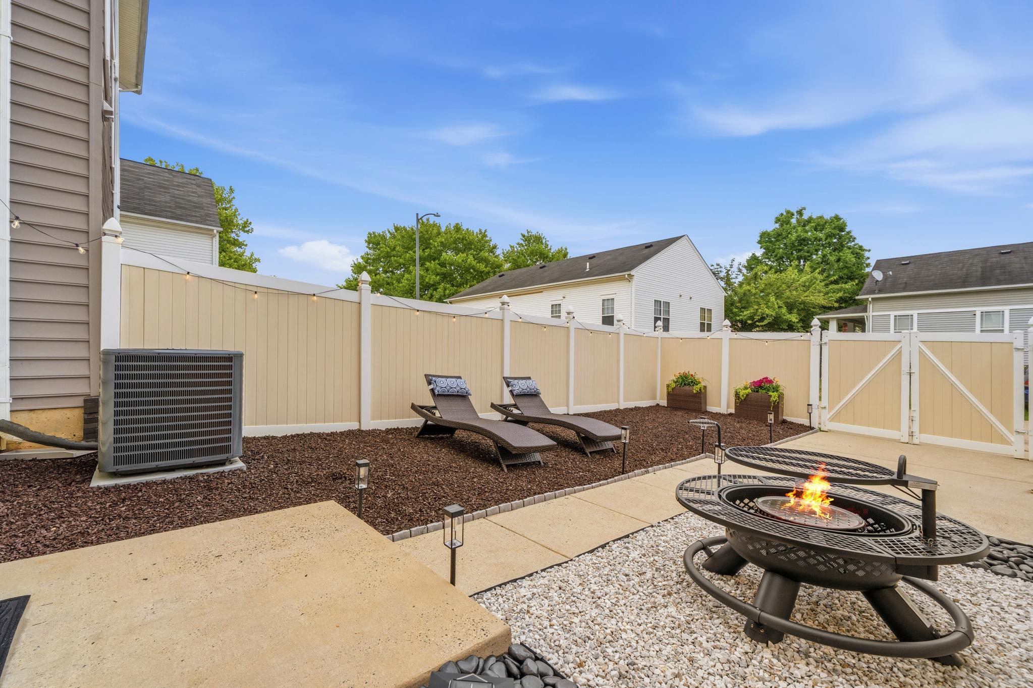 3220 15th Place Southeast Washington, DC 20020 - Photo 28 of 34 Manicured rock garden backyard with firepit