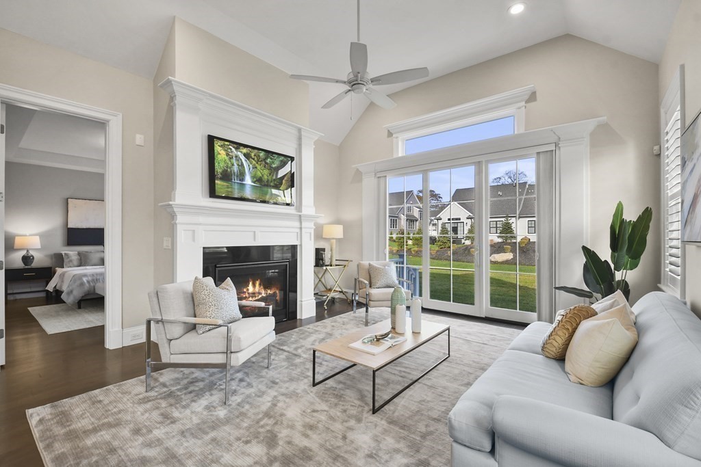 9 Eagle Lane, Unit 9 Framingham, MA 01701 - Photo 11 of 42 a living room with furniture fireplace and a large window
