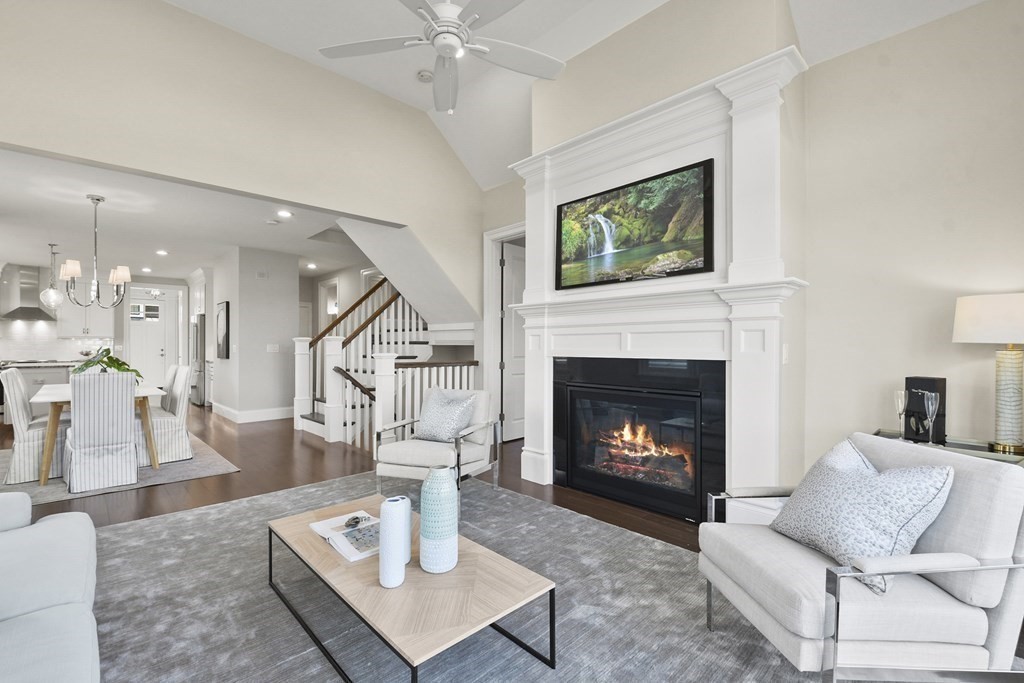 9 Eagle Lane, Unit 9 Framingham, MA 01701 - Photo 13 of 42 a living room with furniture and a fireplace
