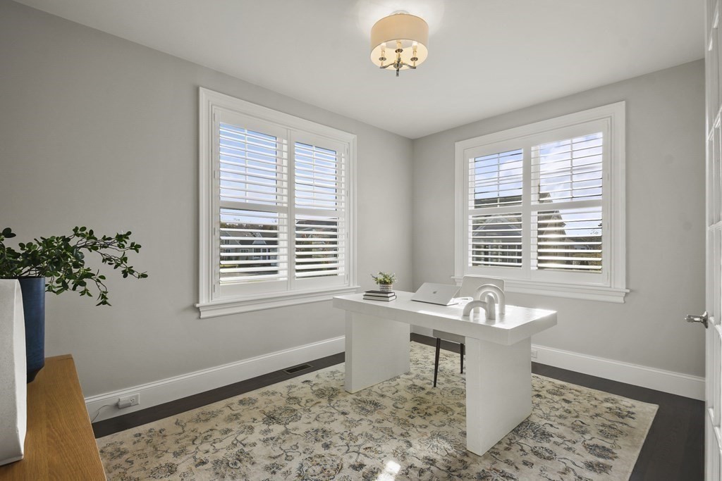 9 Eagle Lane, Unit 9 Framingham, MA 01701 - Photo 18 of 42 a living room with a window and a table