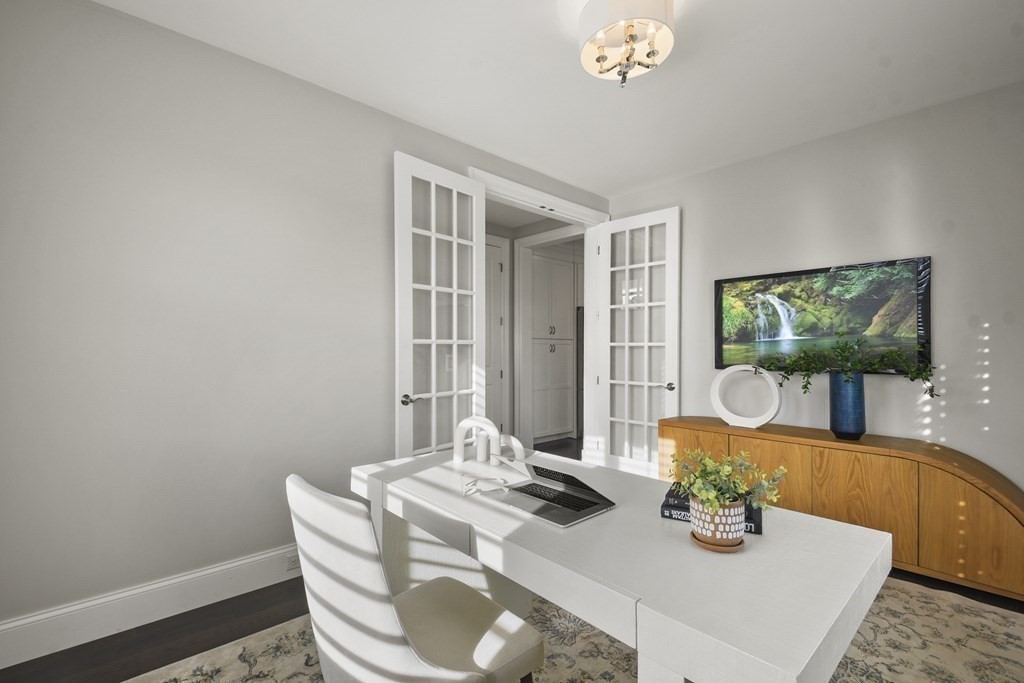 9 Eagle Lane, Unit 9 Framingham, MA 01701 - Photo 19 of 42 a living room with furniture and a flat screen tv