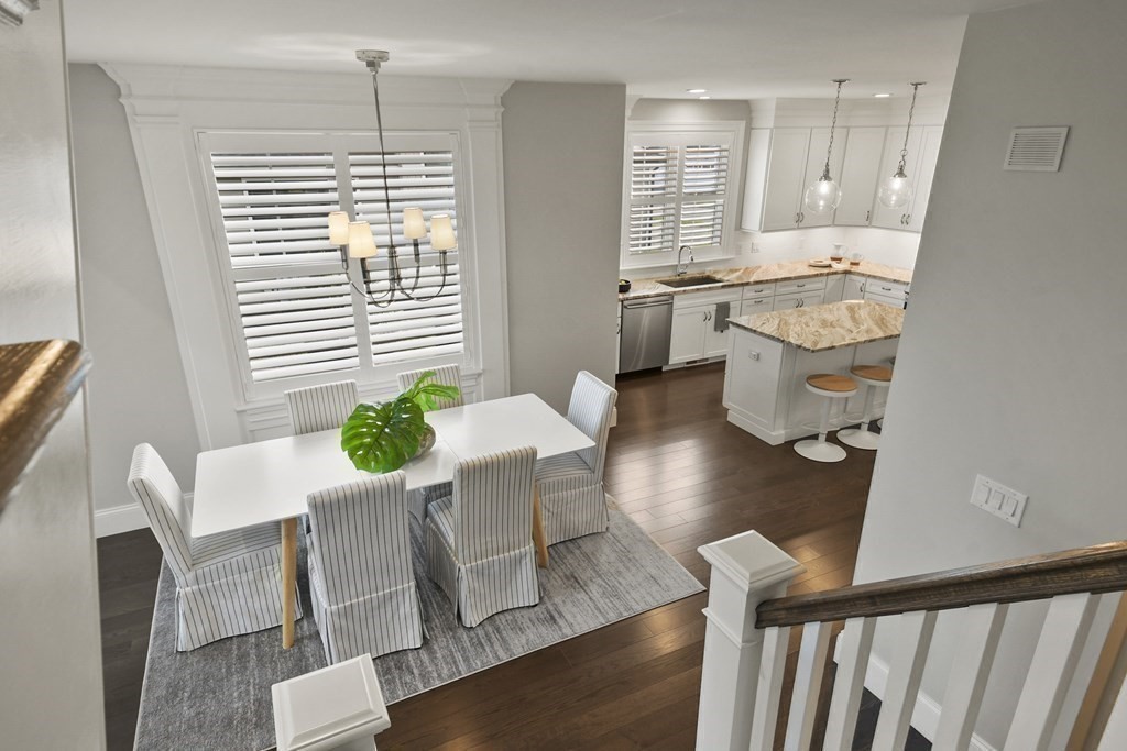 9 Eagle Lane, Unit 9 Framingham, MA 01701 - Photo 20 of 42 a view of a dining room with furniture and a chandelier