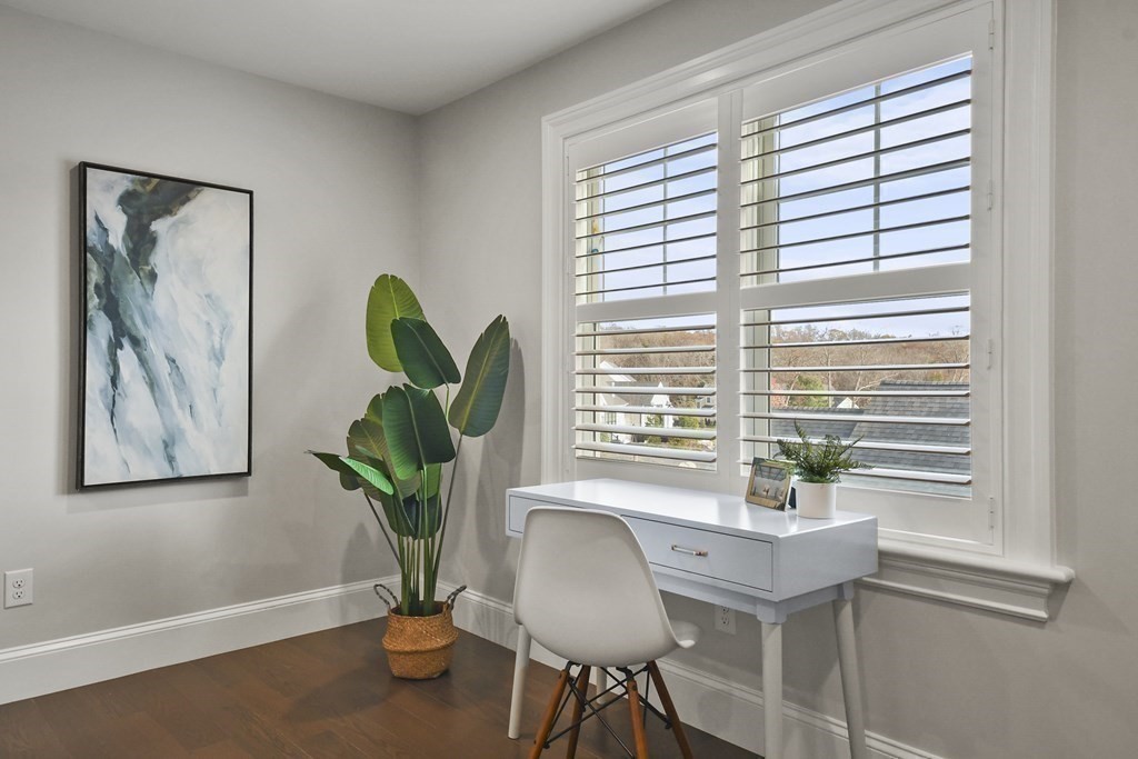 9 Eagle Lane, Unit 9 Framingham, MA 01701 - Photo 22 of 42 a view of a work space with furniture and a potted plant
