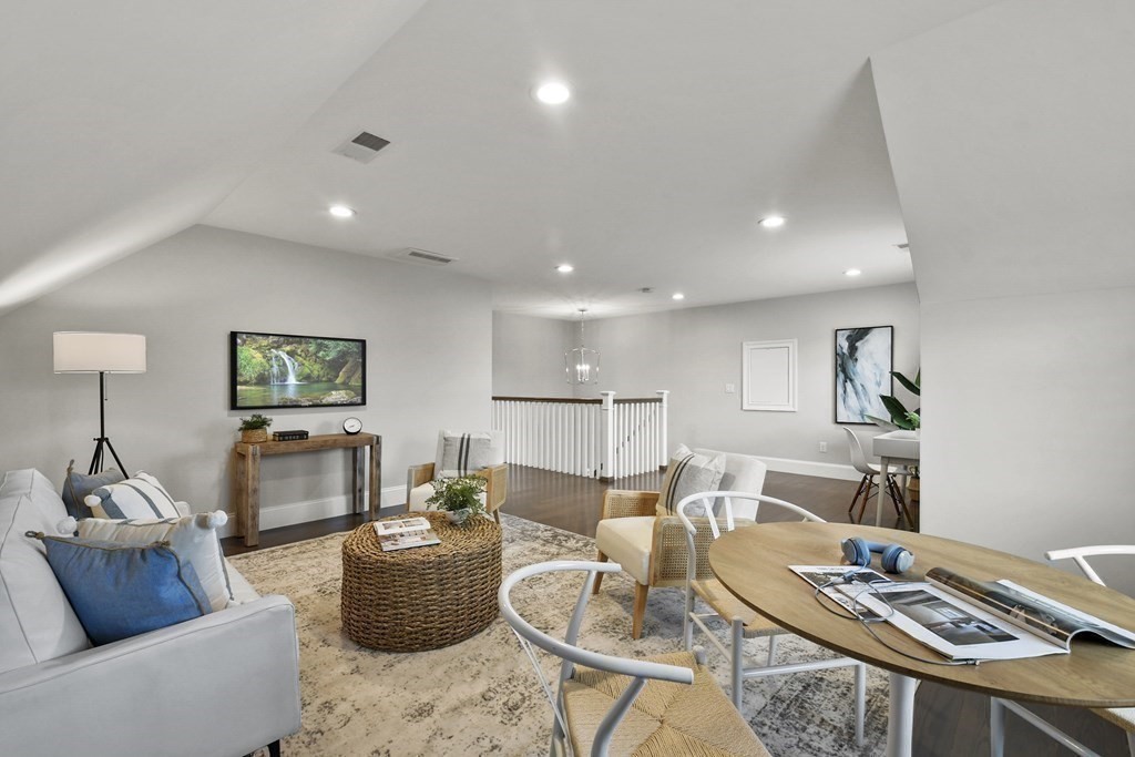 9 Eagle Lane, Unit 9 Framingham, MA 01701 - Photo 23 of 42 a living room with furniture and a table