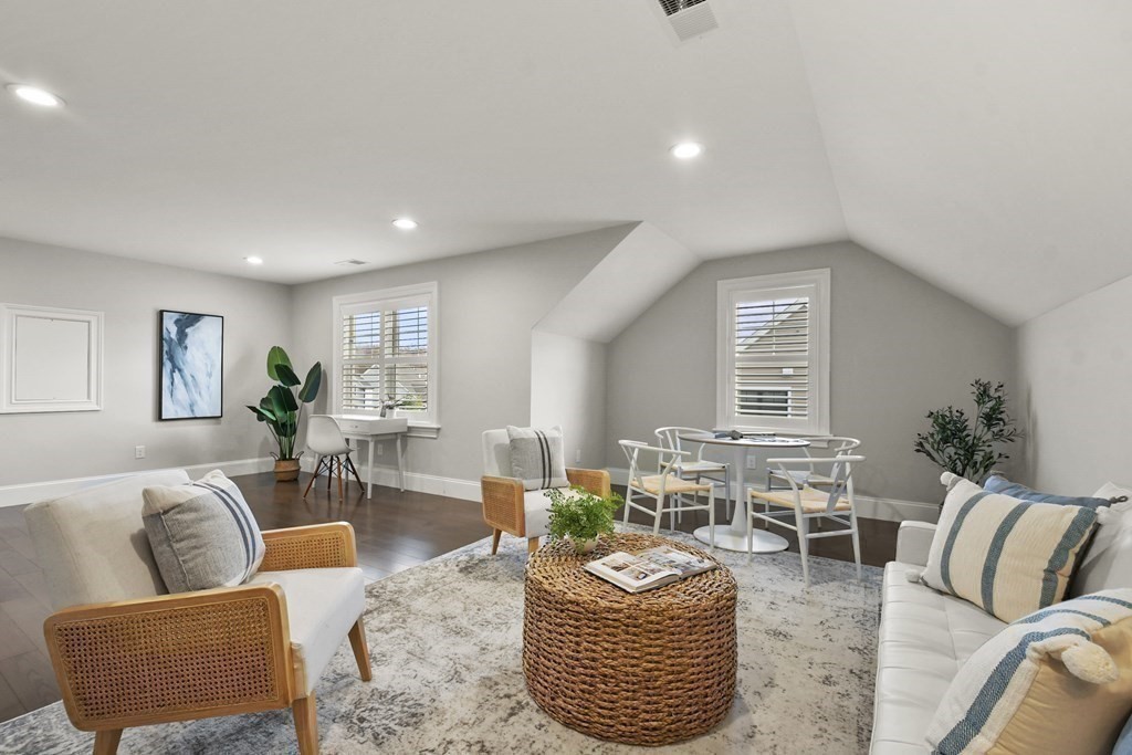 9 Eagle Lane, Unit 9 Framingham, MA 01701 - Photo 24 of 42 a living room with furniture kitchen view and a large window
