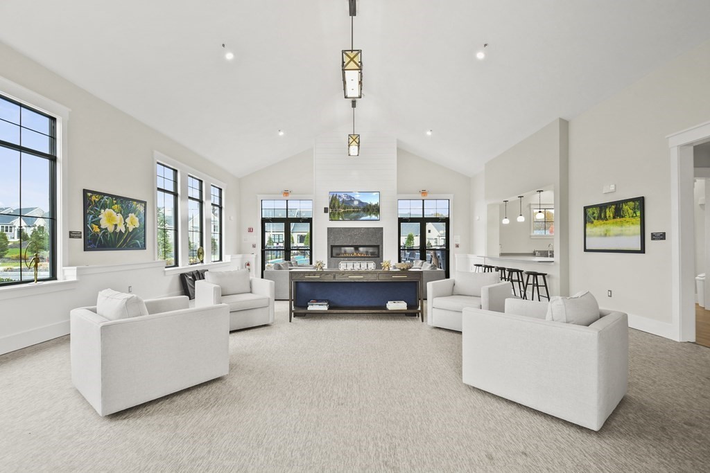 9 Eagle Lane, Unit 9 Framingham, MA 01701 - Photo 34 of 42 a living room with furniture and a large window