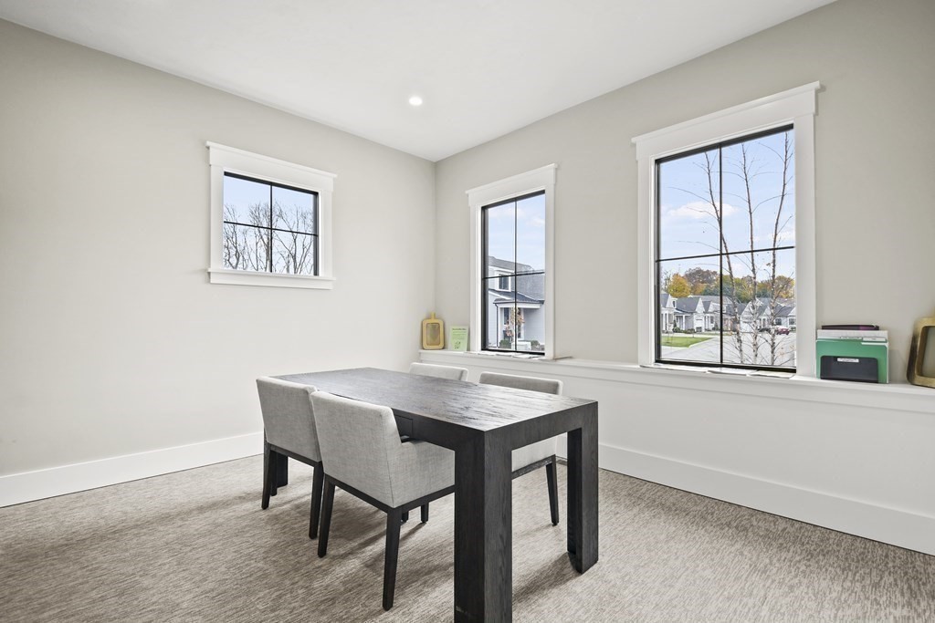 9 Eagle Lane, Unit 9 Framingham, MA 01701 - Photo 39 of 42 a view of a dining room with a table and chairs