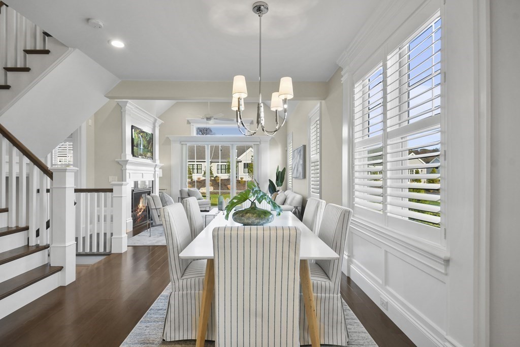9 Eagle Lane, Unit 9 Framingham, MA 01701 - Photo 8 of 42 a view of a dining room and livingroom with furniture wooden floor kitchen view