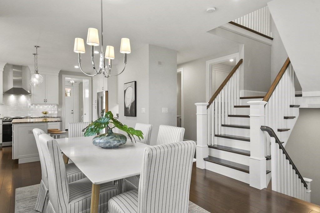 9 Eagle Lane, Unit 9 Framingham, MA 01701 - Photo 9 of 42 a view of a dining room with furniture and wooden floor