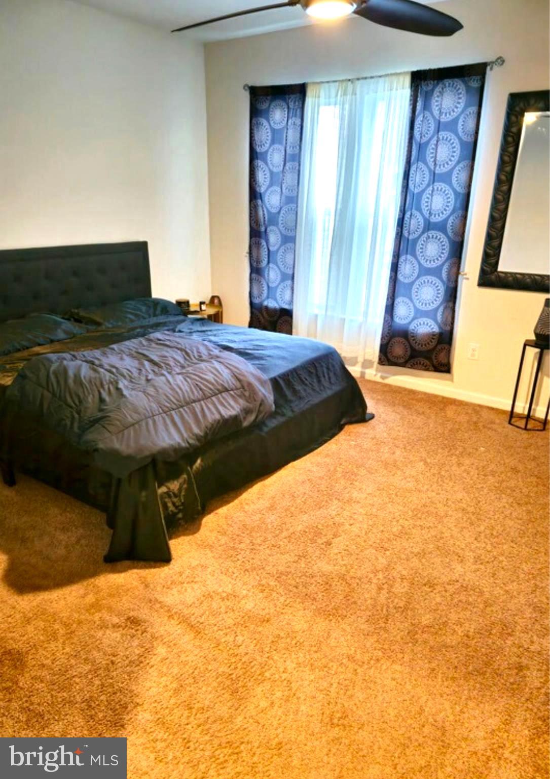 8120 Dalton Way Hanover, MD 21076 - Photo 11 of 22 a bedroom with a bed and wooden floor